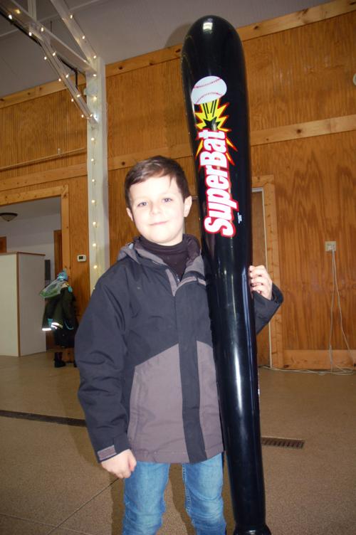 Ryan Adamiak, 7, with giant inflatable baseball bat