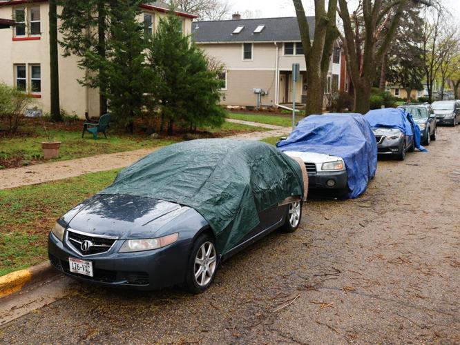 Cars covered in tarps after hail