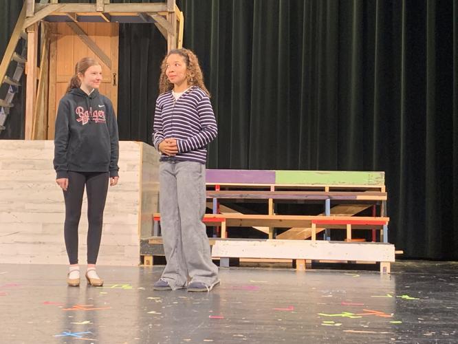 Ellory Severson, left, and Adrianna Buford practice a scene during a recent rehearsal session