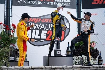 From left, runner-up Alex Palou, winner Christian Rasmussen and third-place finisher Scott McLaughlin celebrate on the podium after the 2025 Snap-on MIlwaukee Mile. They're all drivers to watch in a doubleheader this year.