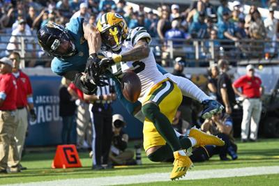 APTOPIX Packers Jaguars Football