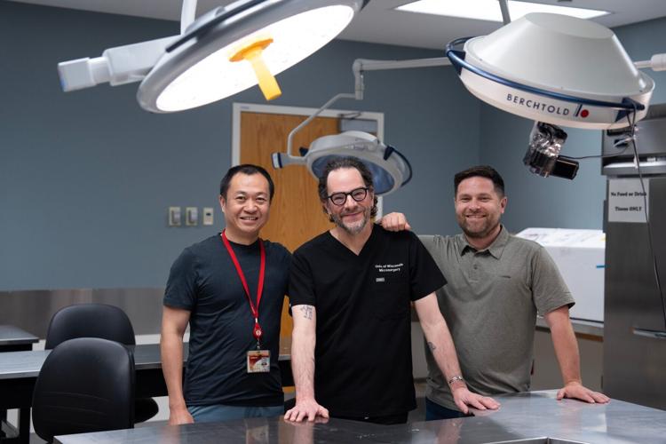 Weifeng Zeng, senior scientist of UW Microsurgery, Dr. Samuel Poore, chair of the UW Division of Plastic Surgery, and Dr. Aaron Dingle, assistant professor in the division, pose for a portrait in the UW Microsurgery Regenerative Medicine Lab.