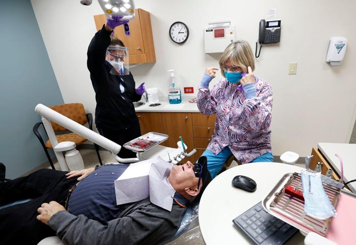 Joseph with hygienist and dentist