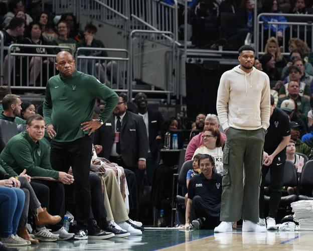 Milwaukee Bucks coach Doc Rivers and forward Giannis Antetokounmpo watch from the sidelines during an April 2026 game.