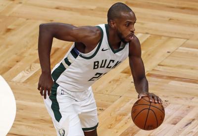 Khris Middleton dribbles, AP photo