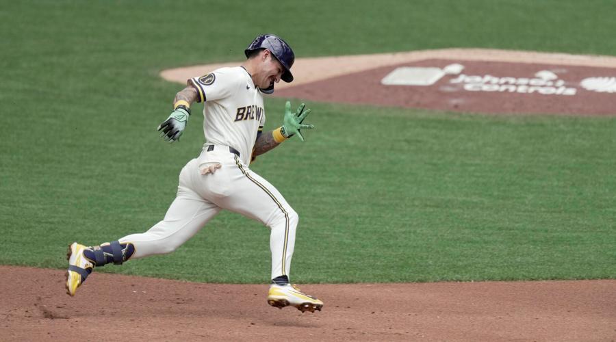 Milwaukee Brewers shortstop Joey Ortiz (3) rounds second base after hitting a two-run triple during the second inning of their
