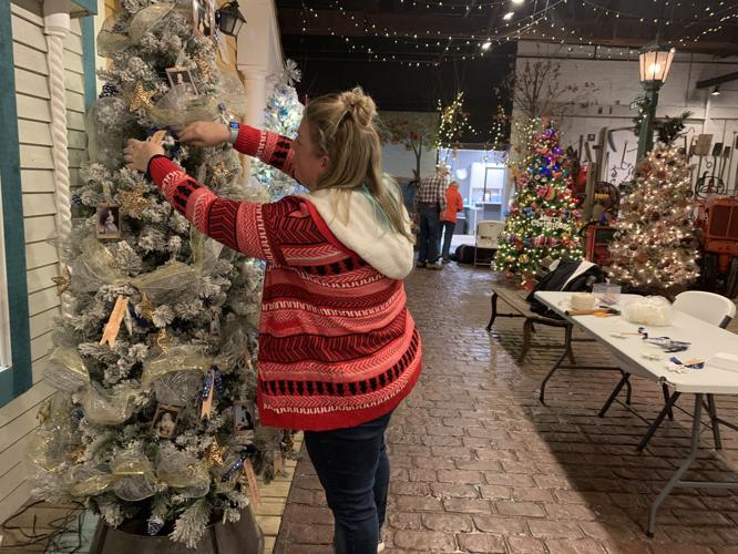 Monica Pfeifer, co-owner of Maxwell Mansion, decorates a Christmas tree for Geneva Lake Museum's "Parade of Trees"