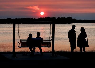 Canada wildfire smoke hazy sunset Lac La Belle in Oconomowoc, Wisconsin, State Journal photo