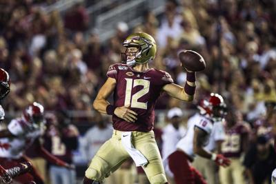 Alex Hornibrook passes, AP photo