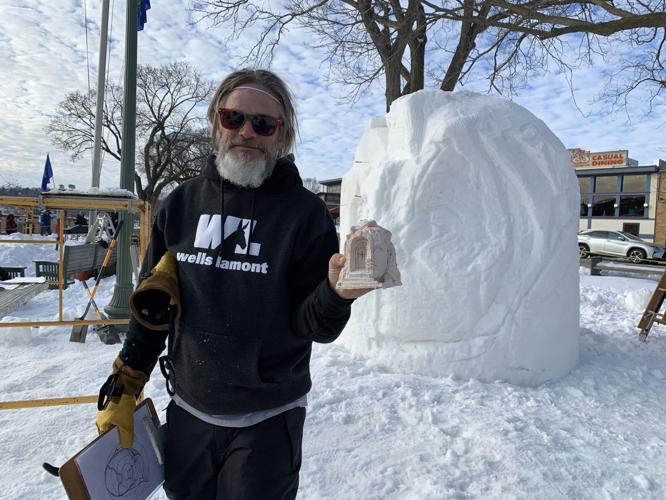 Bruce Peck, member of Florida team "Flozen Less Latitude More Attitude," holds up a model of a sculpture that he and his teammates plan to work on during the U.S. National Snow Sculpting Competition