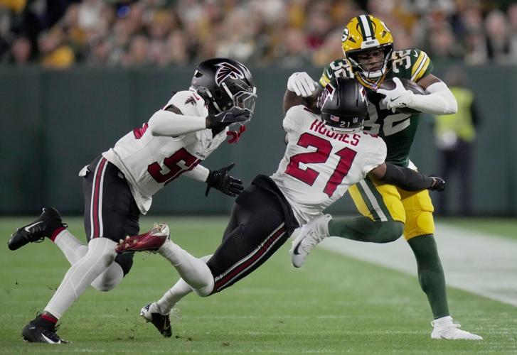 Green Bay Packers running back Marshawn Lloyd (32) is tackled by Atlanta Falcons cornerback Mike Hughes (21) during the first