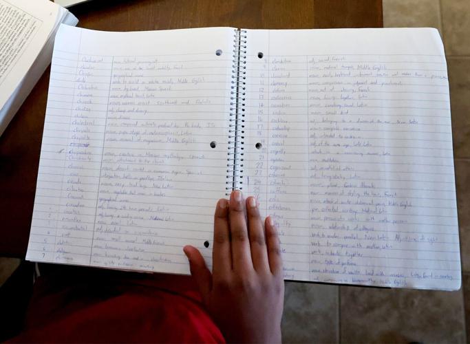 Ethan Robert takes notes to study for spelling bee