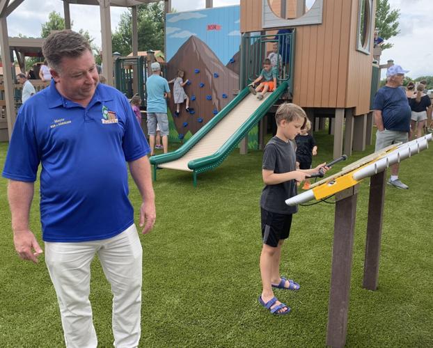 Mayor Ryan Schroeder looks over some of the equipment at the Never Say Never Playland