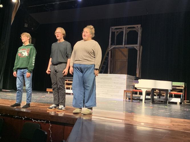 Eli van de Berg, from left, Nicholas Bowler and Emma Derrick rehearse a musical number