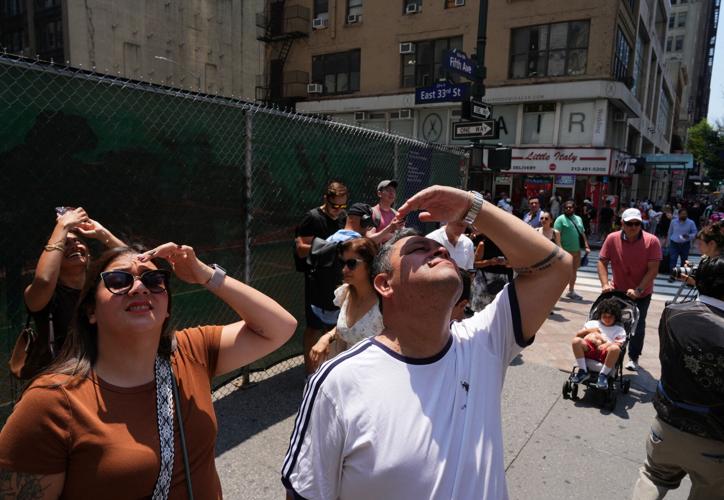 Two people stage a protest atop the Empire State Building in the Manhattan borough of New York