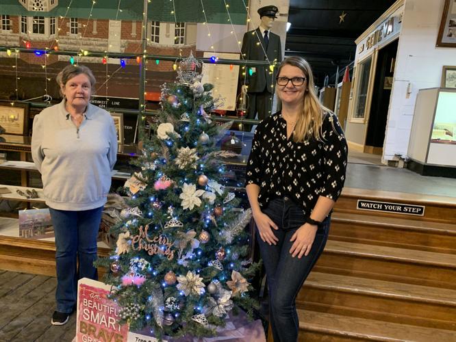 Debora Krause and Corrine Krause stand next to their "princess tree"