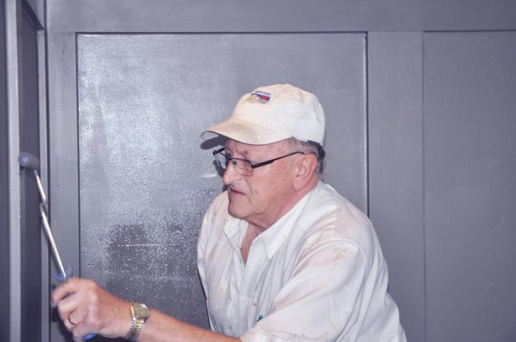 Frank Weyhrauch of Cal Johnson Decorating does some painting in the future site