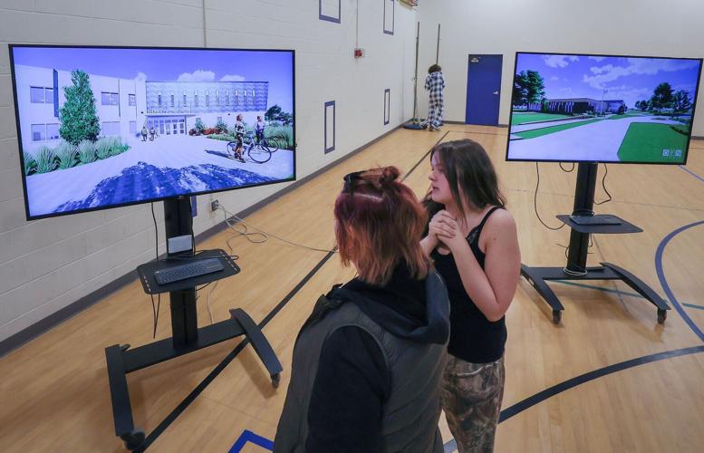 Groundbreaking visitors view design simulations