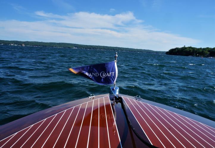 Grand Craft flag flies on company's new Burnham runabout during Geneva Lake drive