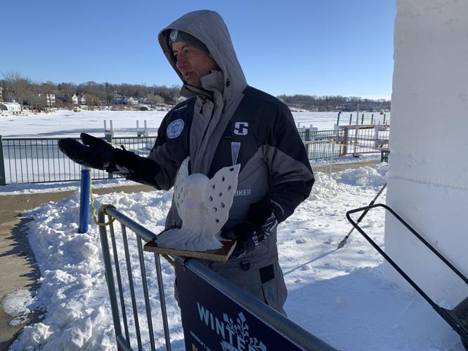 Team Mexico Captain Carlos Miguel Ramirez Pereyra holds up a model of his team's sculpture