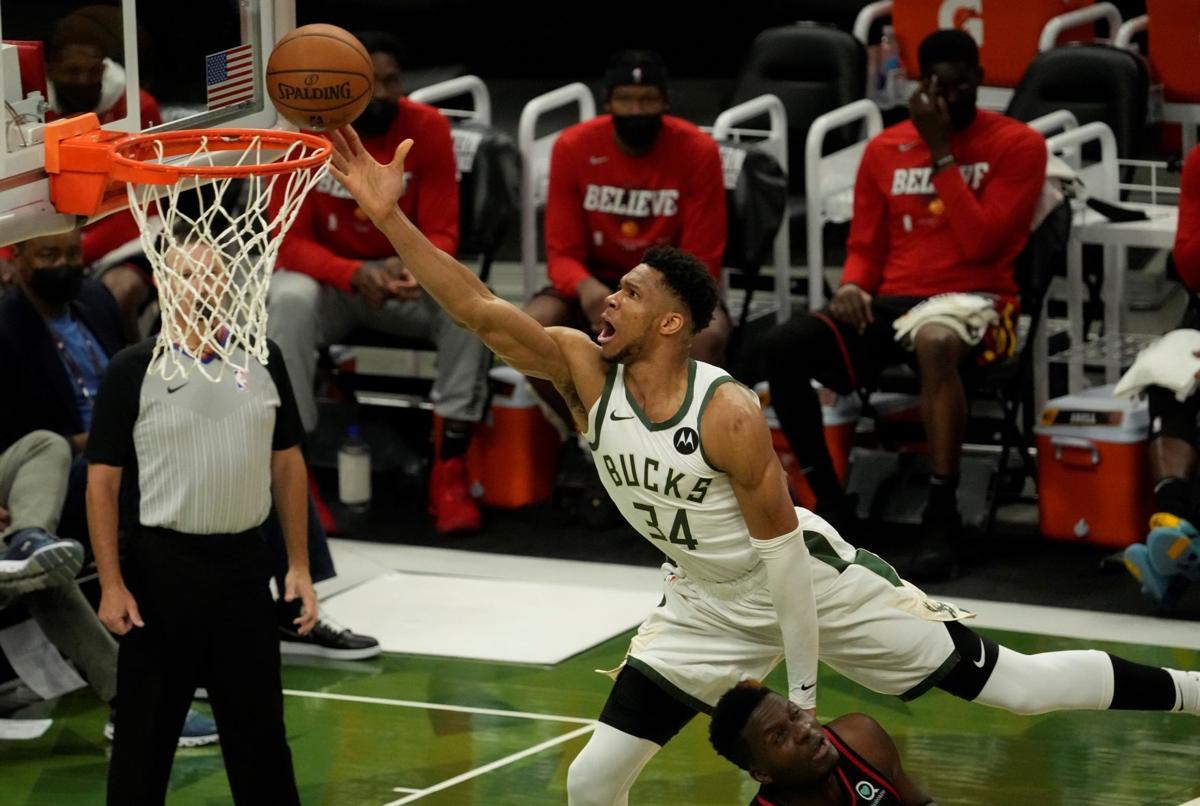 Bucks stifle Trae Young, rout Hawks to even Eastern ...