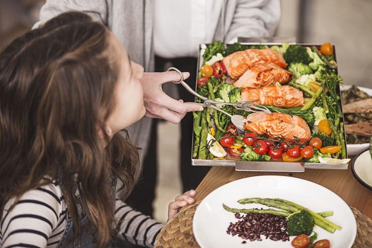 Family dinner_girl served salmon portions_ww_all media.tif