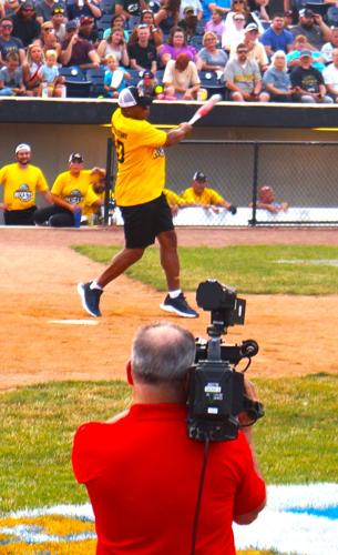Mike Singletary connects at the plate for the Gold Team at the July 15 Legends Celebrity Softball Game at Rockford Rivets Stadium