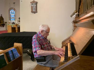 Roy Clare plays the organ during the farmers market on Thursdays