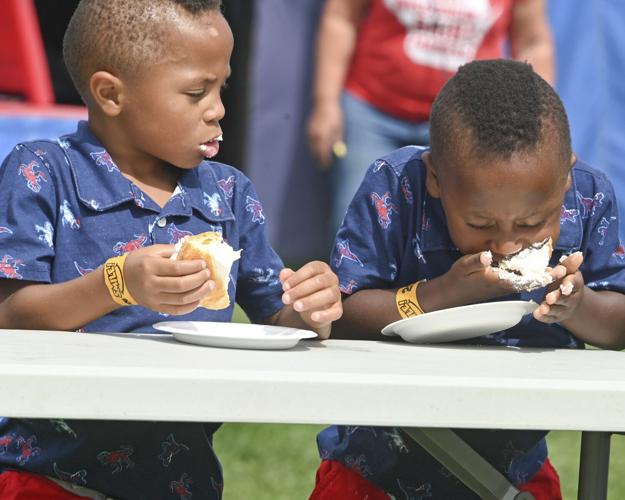 "Twins in Cream Puff Eating Contest" by Tom Ganser