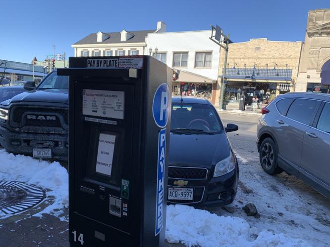A sign on a  parking kiosk in Downtown Lake Geneva reminds people that paid parking begins Feb. 1