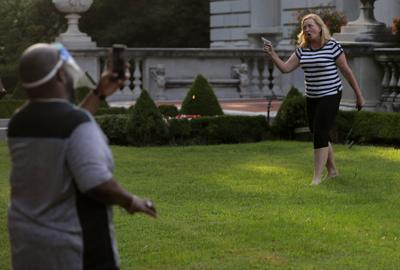 CWE couple display guns during protest