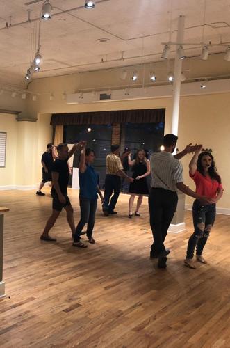 English Swanson leading a ballroom dancing class