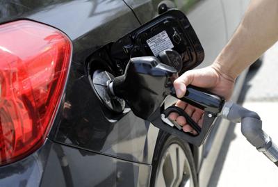 Person pumping gas, AP generic file photo
