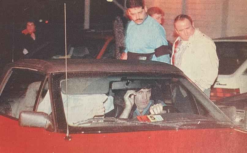 Elwood and wife Janice hide in car