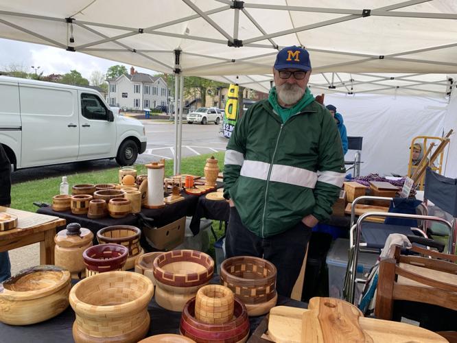 Kent Mayes of Kenosha prepares to sell some of his wood craft items