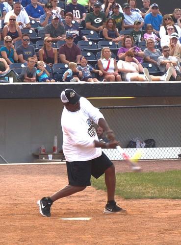 Retired Green Bay Packer safety George Teague connects at the plate during the July 15 Legends Celebrity Softball Game at Rockford Rivets Stadium in Loves Park, Ill.