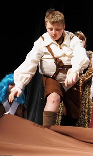 Augustus Gloop gets swallowed up by Willy Wonka's molten chocolate river