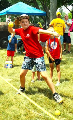 Meta Akerly takes aim at the Sharon Lions Club dunk tank fundraiser on July 4