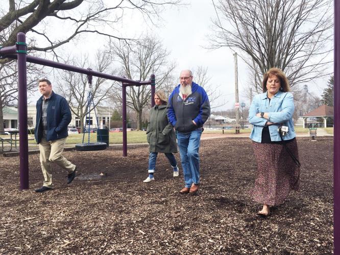 Echo Lake steering committee members walk through park on tour of lake