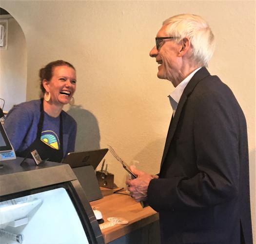 Gov. Tony Evers shares a laugh during his visit at Hill Valley Dairy, Lake Geneva