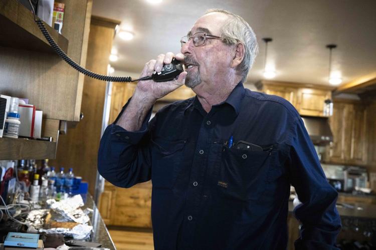 Bill Galt radios ranch workers