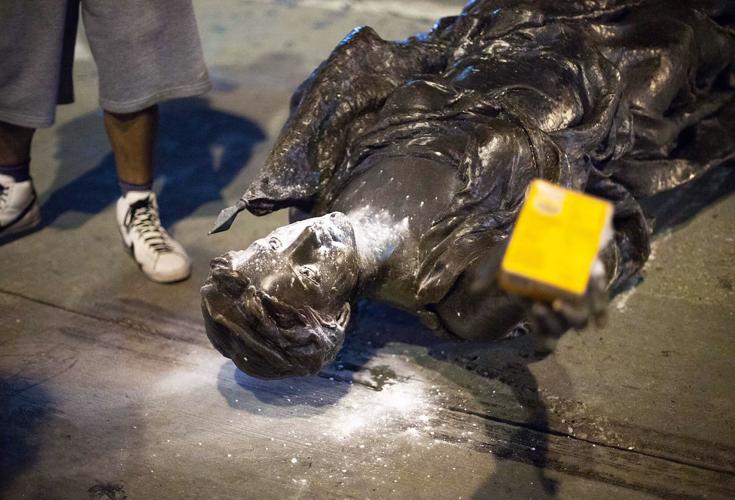 "Forward" statue toppled, State Journal file photo