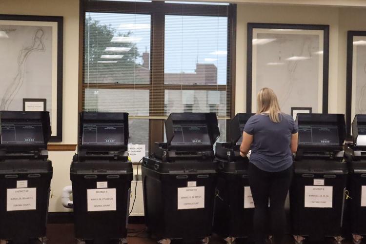 Skyla Jacobi counts absentee ballots