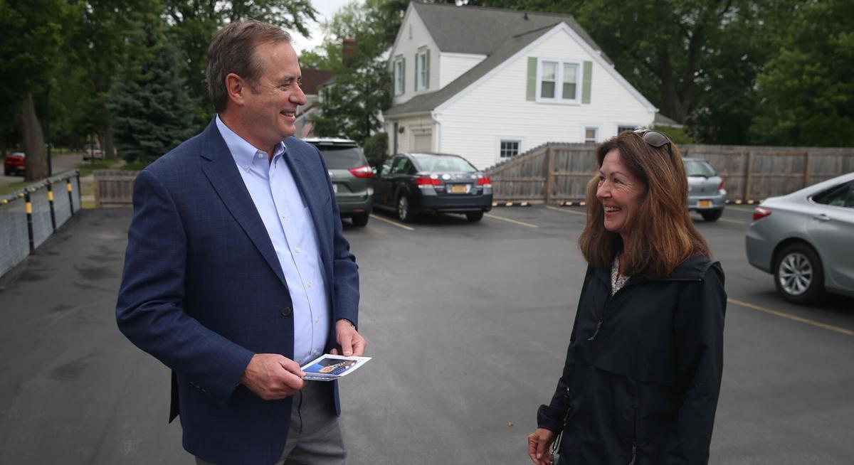 John Garcia talks with Tammy Norris as he campaigns on primary day