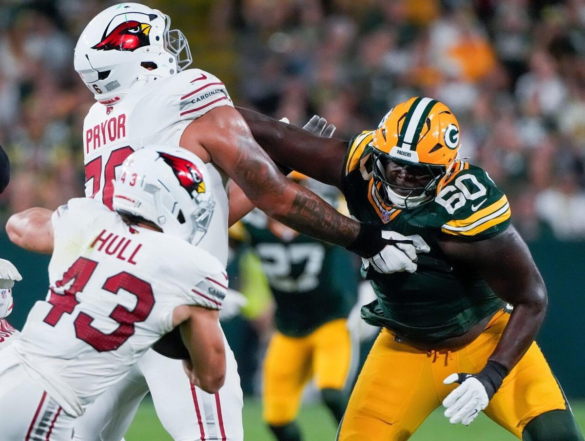 Green Bay Packers defensive tackle Anthony Campbell (60) fights off of a block by Arizona Cardinals offensive tackle Matt Pryor
