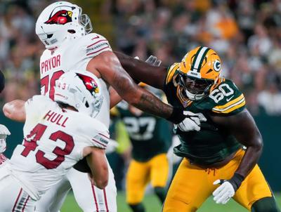 Green Bay Packers defensive tackle Anthony Campbell (60) fights off of a block by Arizona Cardinals offensive tackle Matt Pryor