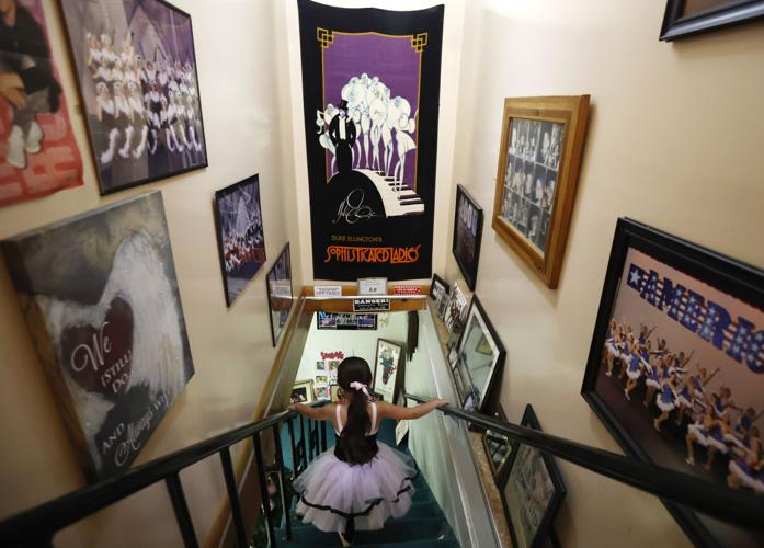 Young dancer heading downstairs to studio