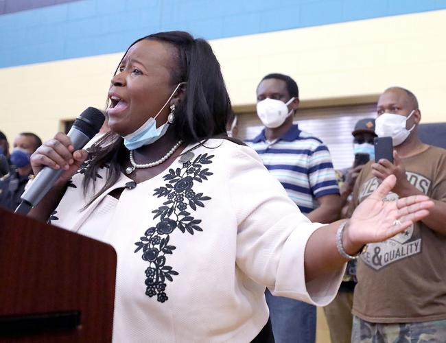 Community and police leaders kneel for George Floyd