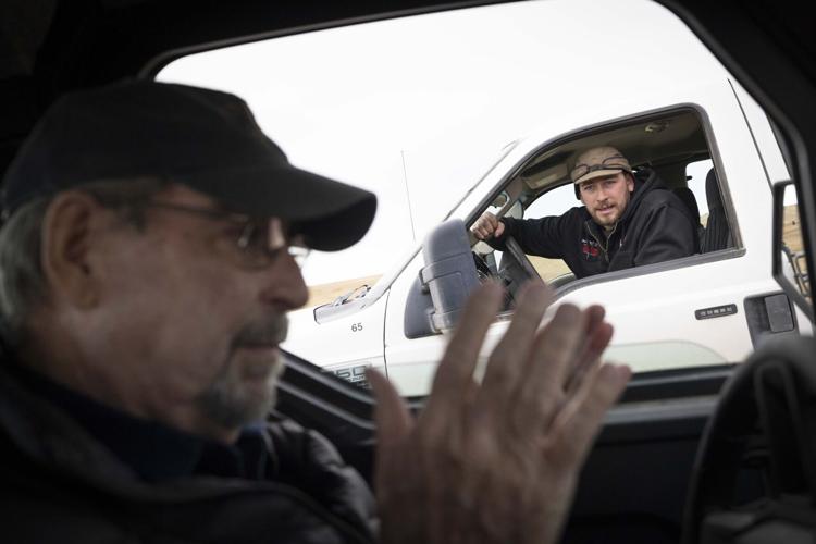 Bill Galt, left, talks