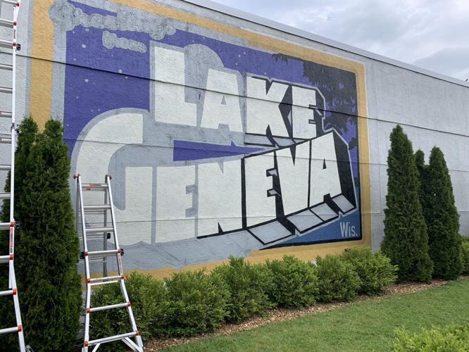 A postcard theme mural has been painted on the Melge's Real Estate building
